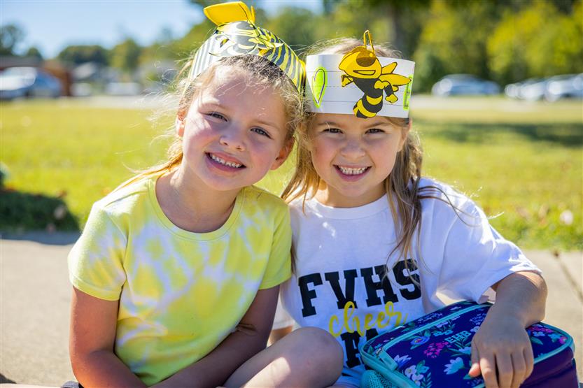 Two girls smile